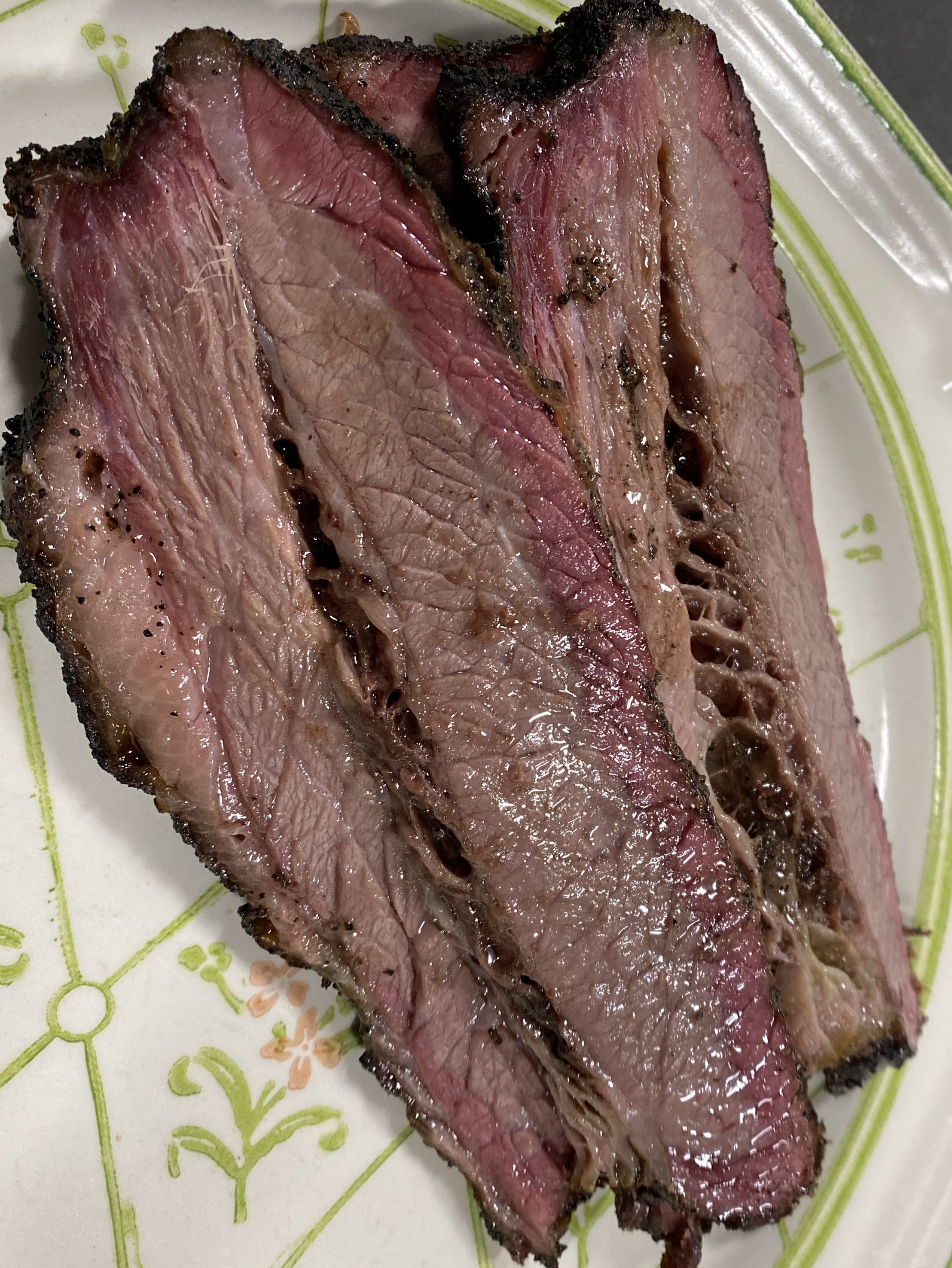 Smoked beef brisket sliced on a plate