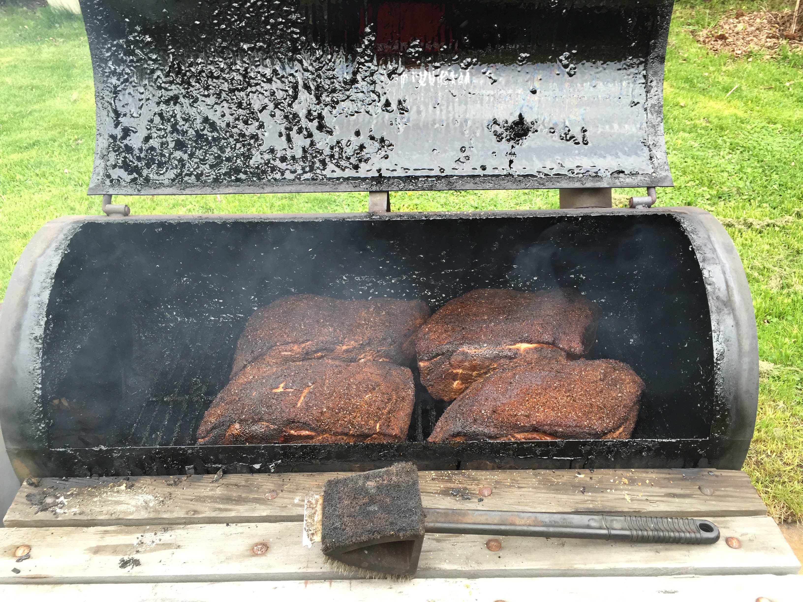 Smoked pork butt shoulder in smoker